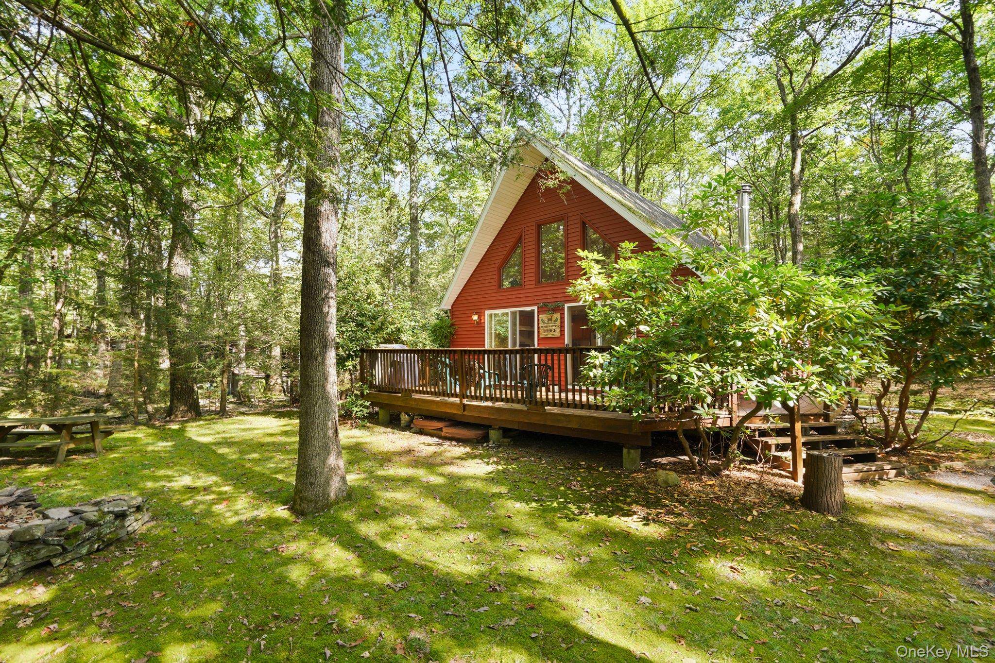 Tucked within the forever wild private community of Wolf Lake, 16 Canal Road offers the rare combination of convenience and tranquility.