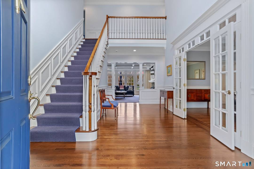 Located in Westport's coveted Greens Farms neighborhood, this light filled home is perfectly sited high and dry on a private park like acre with room for a pool and pool ...