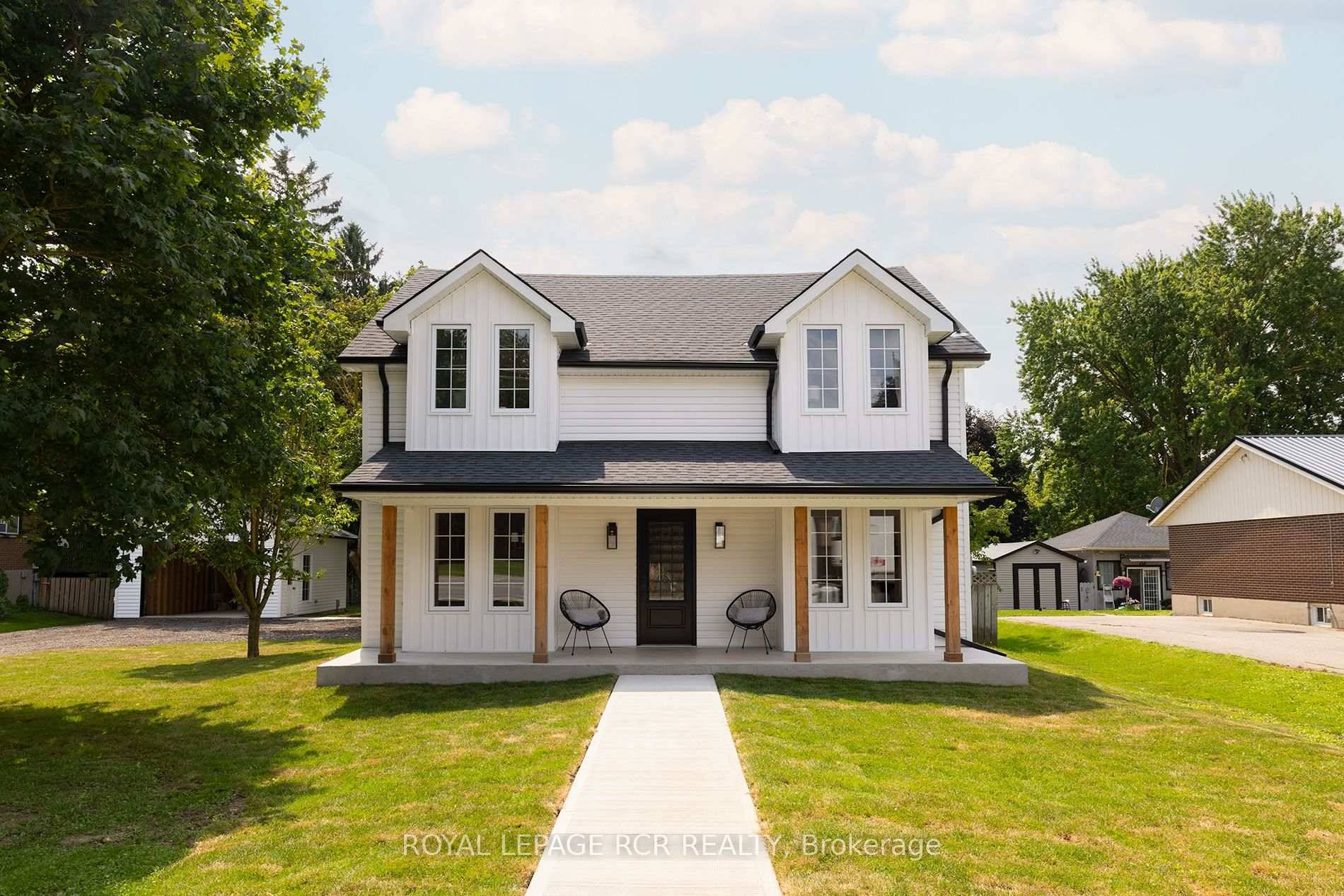 Nestled on an expansive lot in downtown Arthur, this exquisite 4 bedroom, 3 bathroom home has undergone a complete transformation, blending classic architecture with elevated modern finishes.