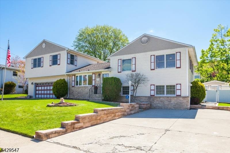 Located in the highly desirable community of Rockaway Township, this spacious split level home offers 4 bedrooms and 2.