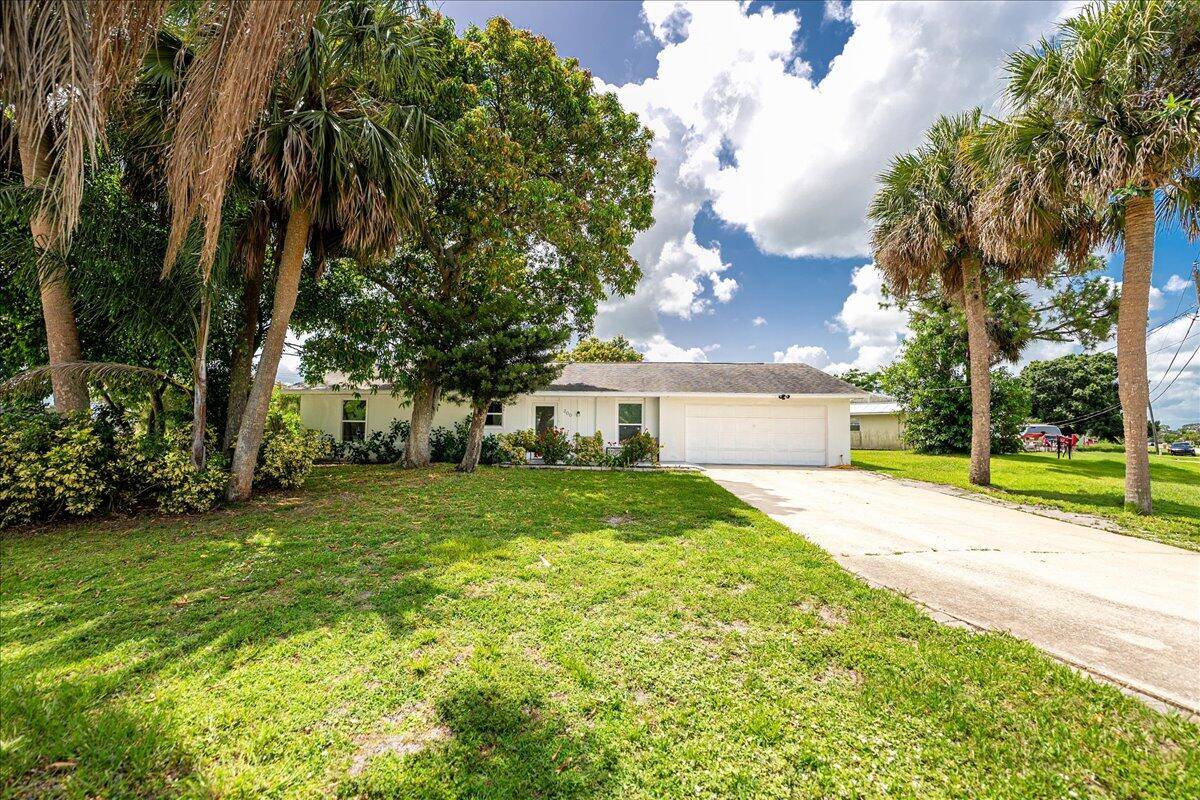 Come see this 4 bedroom home on an oversized corner lot, easily converted to a 3 2 flex room.