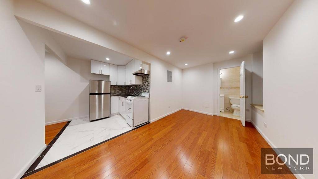 Renovated 2 bedroom apartment with oak floors and a marble bathroom on a very desirable East Village block.