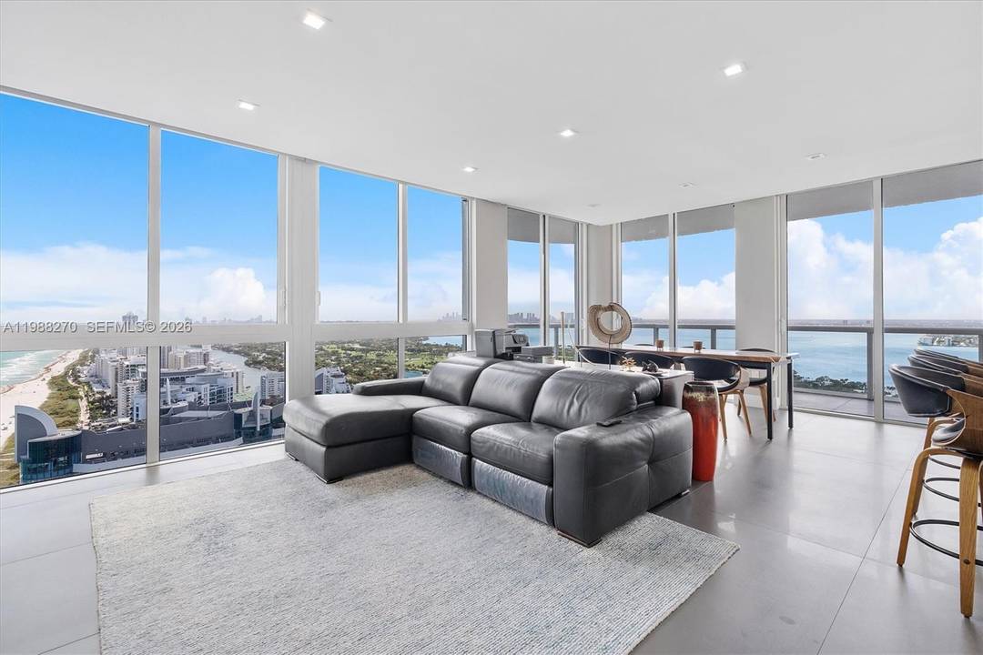 Completely renovated 2 bedroom, 2 bathroom corner unit on the 43rd floor, featuring floor to ceiling windows, open concept layout, wraparound balcony with panoramic views of the ocean, Miami skyline, ...