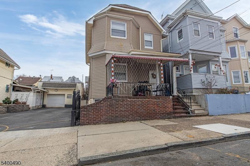 Charming Two Family Home on a cul de sac featuring 5 bedrooms and 2 full bathrooms.