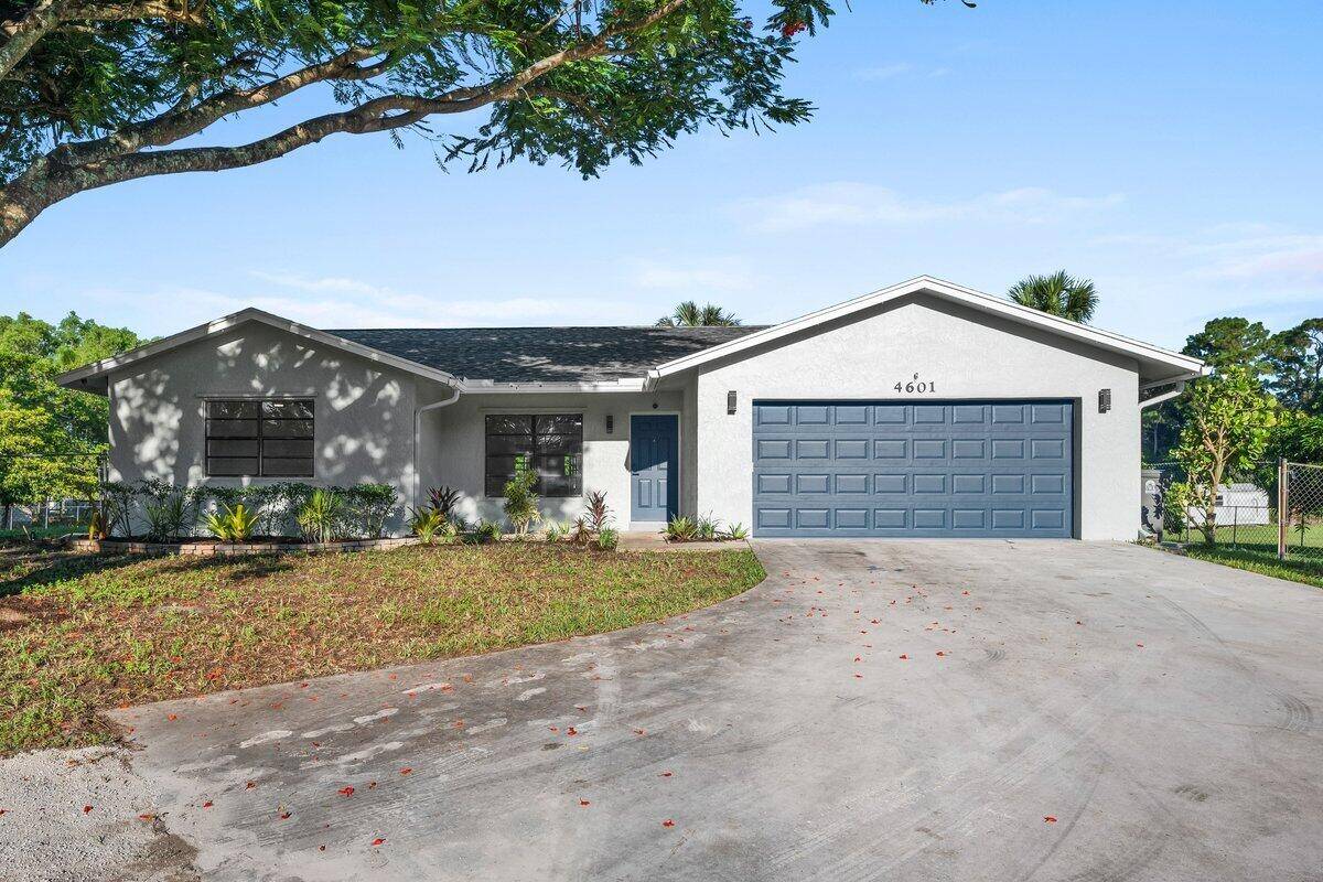 Beautifully updated 3 bedroom, 2 bath home with a 2 car garage in the Acreage.