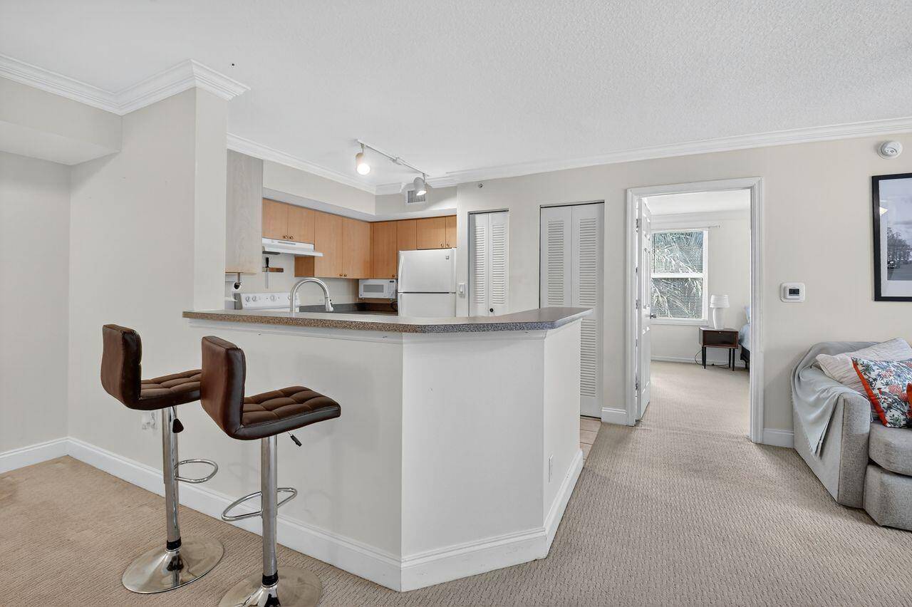 This Move in Ready Charming Corner 2 Bedroom 2 Bathroom Condo in the Beautiful Gated Community of Mirabella Offers an Open, and Split Floor Plan, 2019 AC Unit, Soaking tub, ...