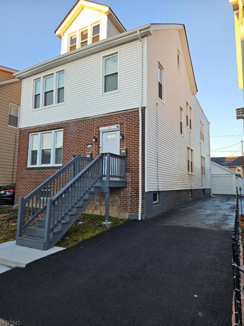 Completely renovated 2 family home with new windows, roof, vinyl siding, new kitchen and bathrooms.