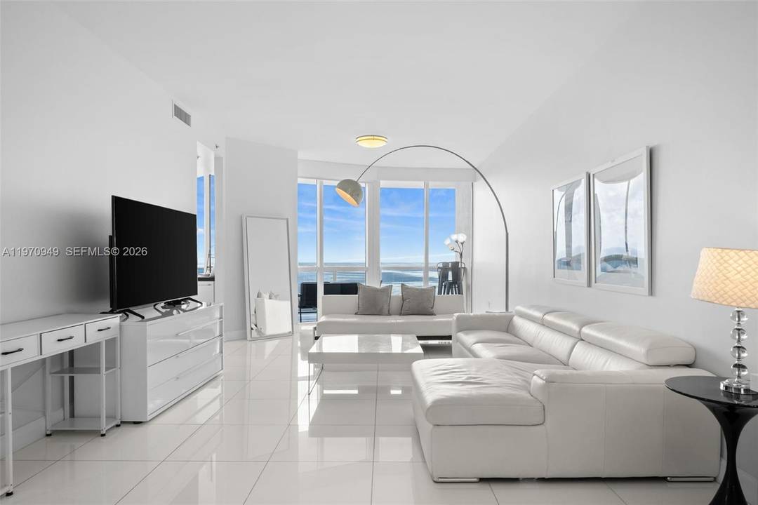 Experience elevated oceanfront living in this stunning 2 bedroom, 2.