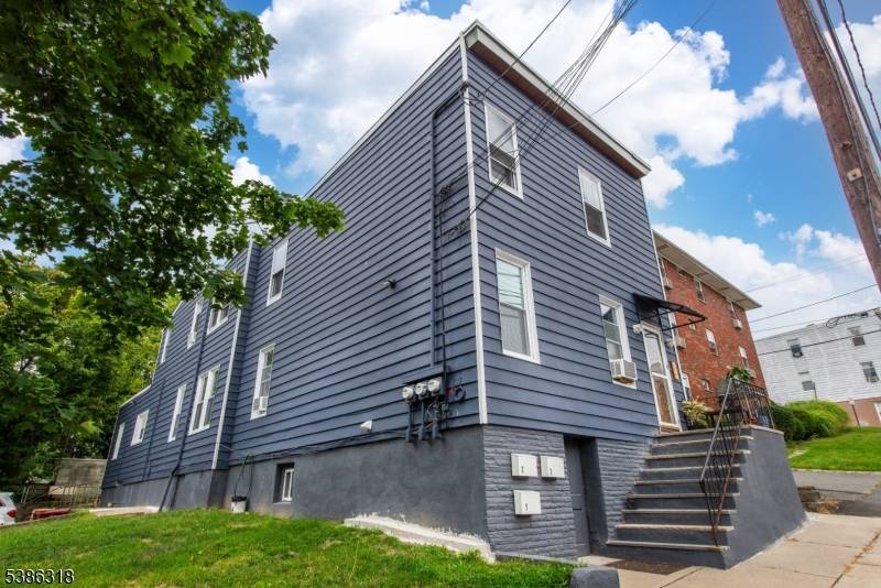 Own an income producing 3 family on an oversized lot in the heart of Nutley.