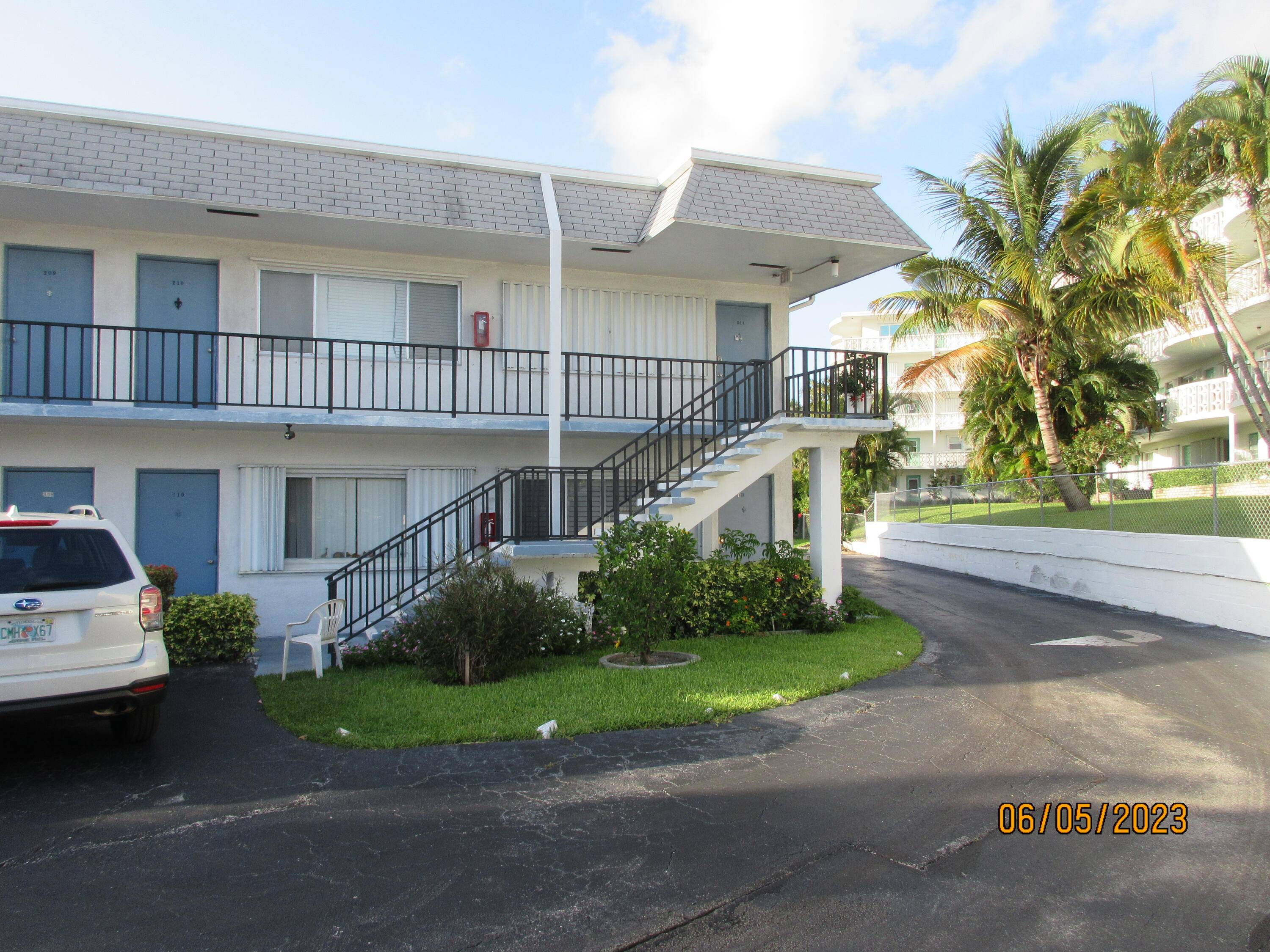 First Floor corner unit with impact glass windows, plantation shutters and updated bathroom.