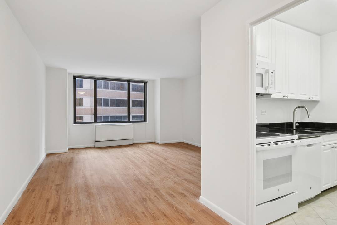 Spacious and bright one bedroom with a fully equipped windowed kitchen, large living room with space for a dedicated dining area or home office, a windowed bath, and wood floors ...