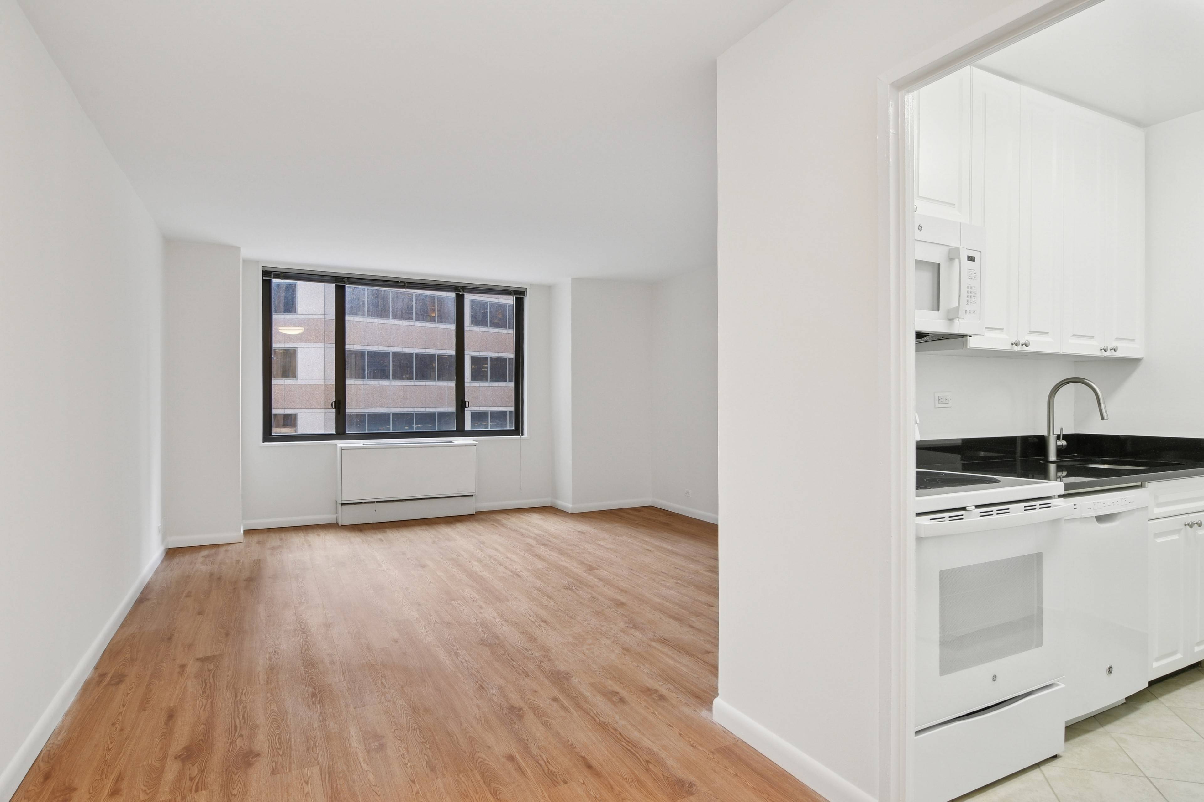 Spacious and bright one bedroom with a fully equipped windowed kitchen, large living room with space for a dedicated dining area or home office, a windowed bath, and wood floors ...