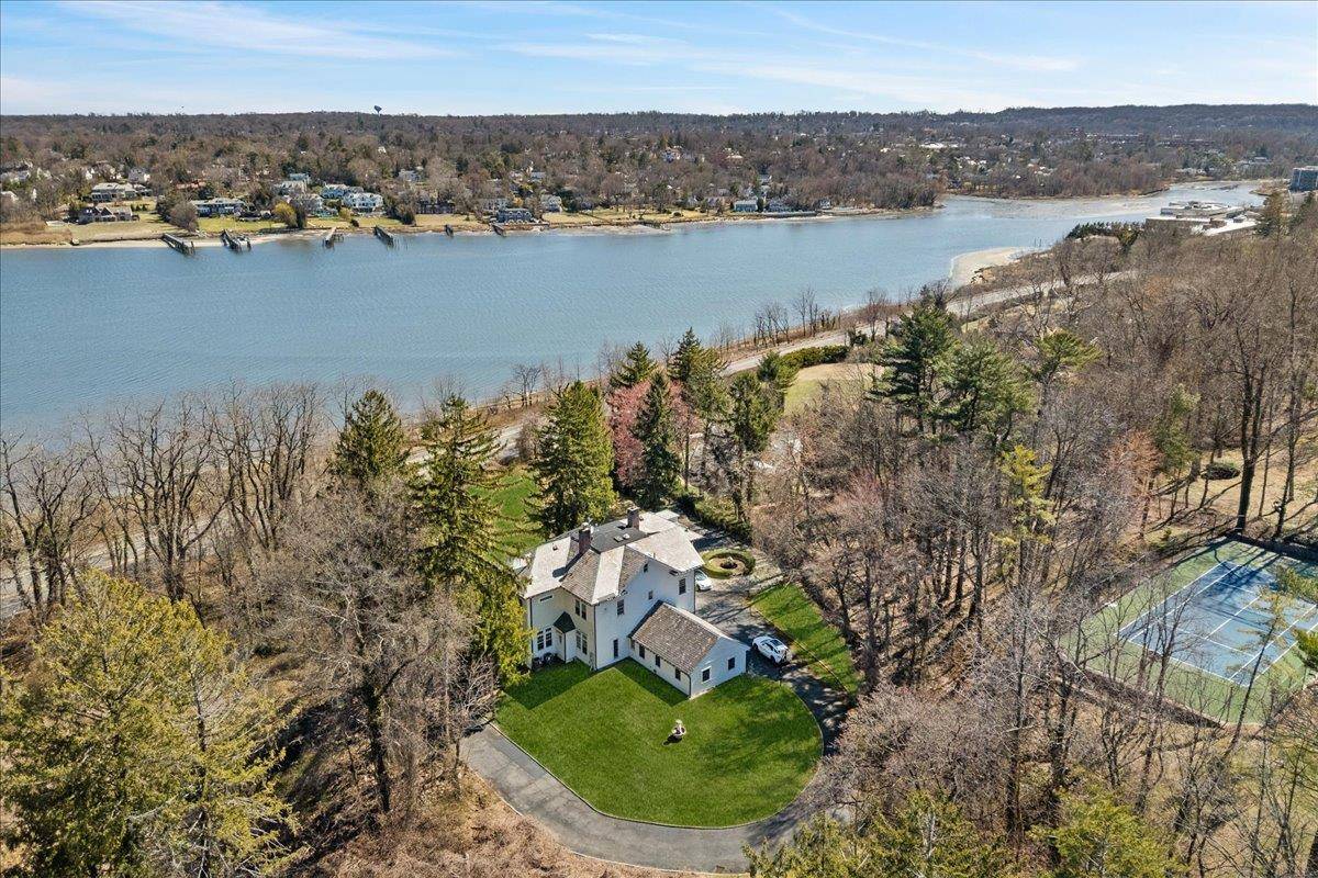 Nestled in the prestigious Kings Point neighborhood of Great Neck, this exceptional estate spans 5, 445 sq ft and is set on 1.
