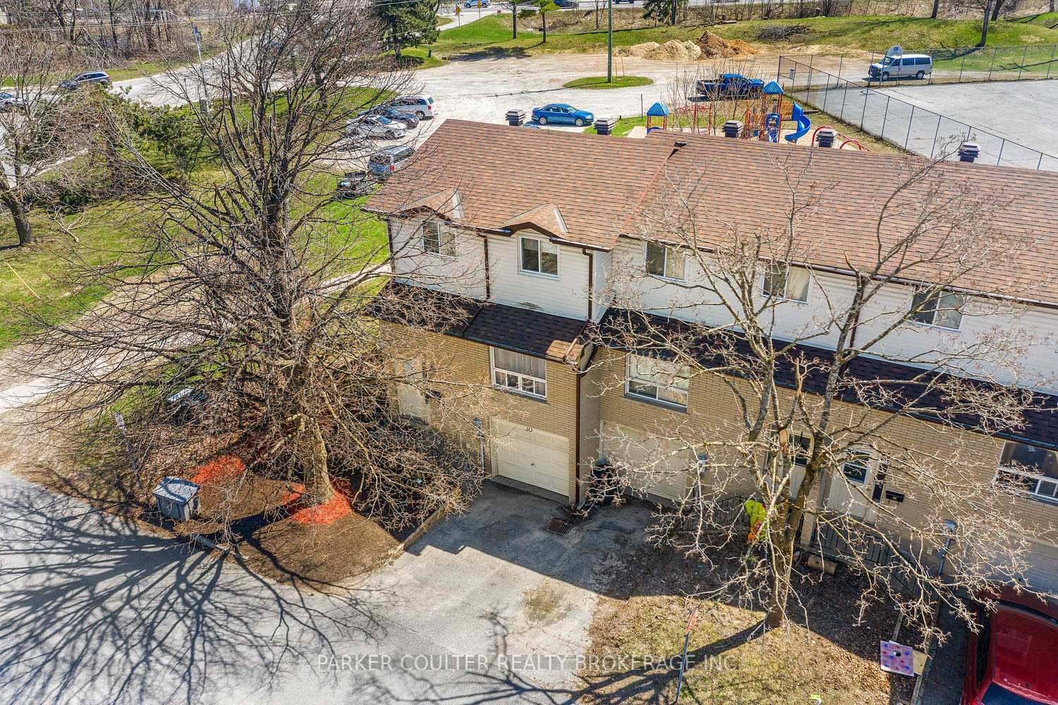 Priced to sell, this centrally located townhome is an end unit with a park right behind.