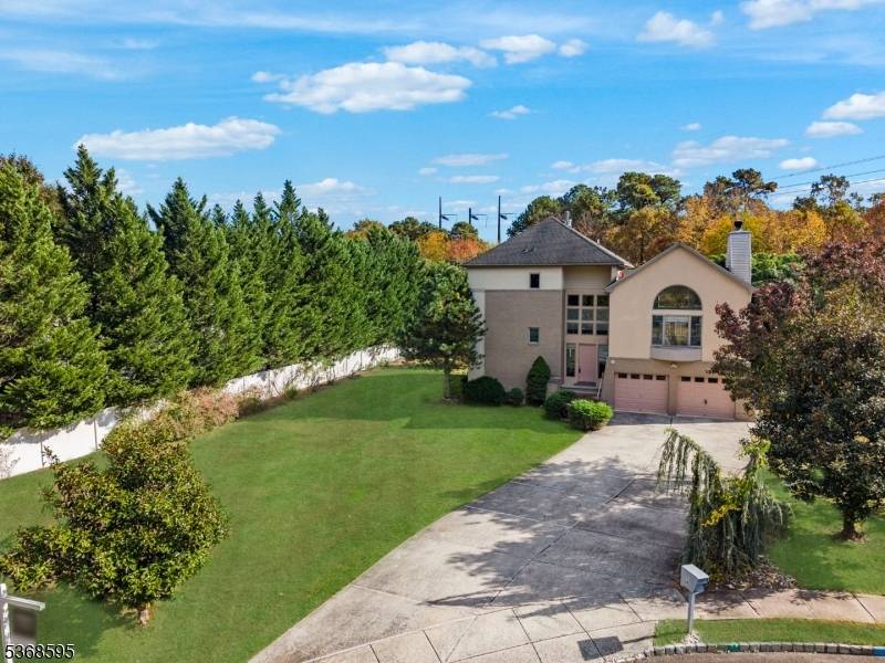 Rare Opportunity ! This 3 story contemporary colonial style dwelling is about 3, 776 Sq ft per bank appointed valuation company's measurements of heated living space on 1.