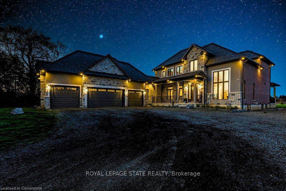 Experience refined living in this exceptional custom built 2 storey home, set on nearly 2 acres of peaceful countryside.
