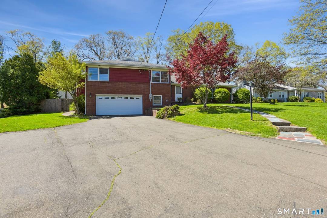 This upper Westville brick split level home offers large, sunny spaces and a great mid century vibe.