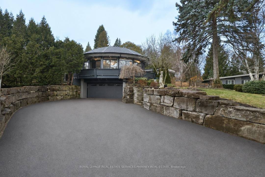 This exceptional luxury residence presents a rare opportunity to own a private, architecturally distinct home in one of Mississauga's most exclusive enclaves of Lorne Park.