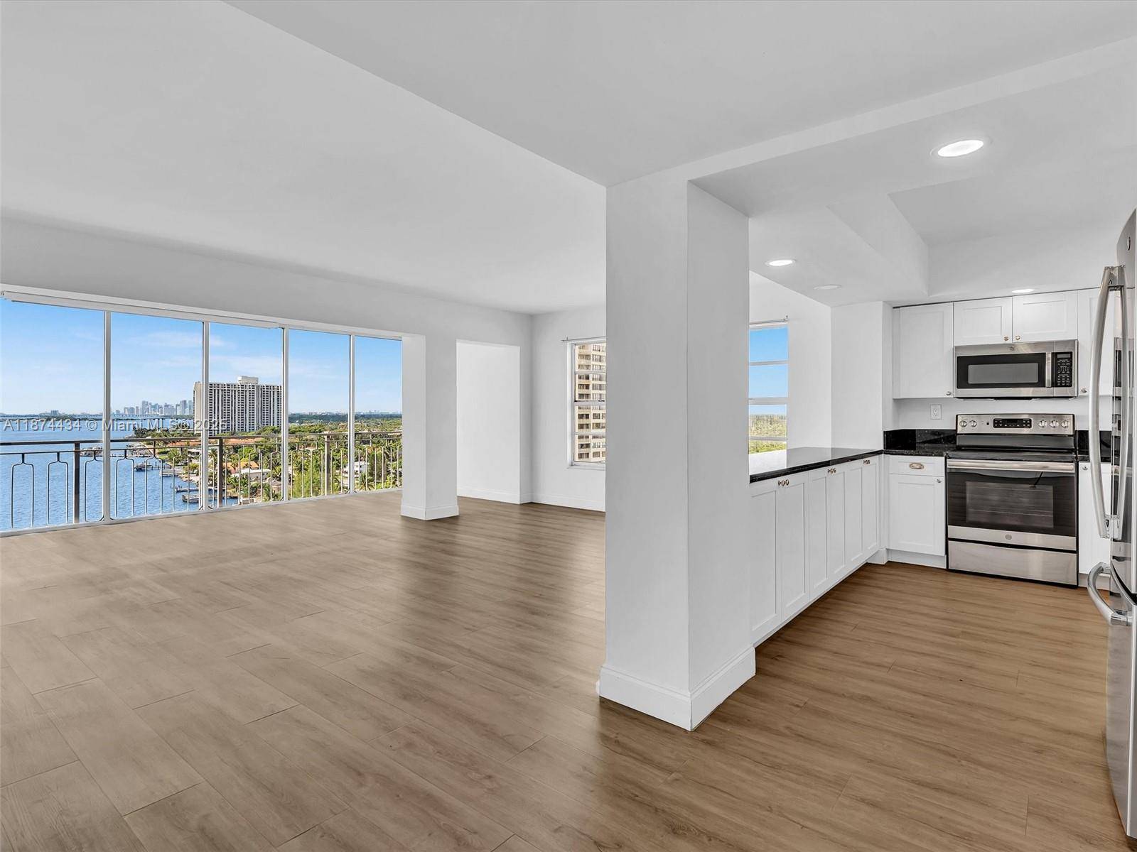 Welcome to an exceptional and versatile opportunity at 11111 E Biscayne Blvd 14G a unique 2 bedroom, 2 bathroom, split condominium unit in the iconic Jockey Club.