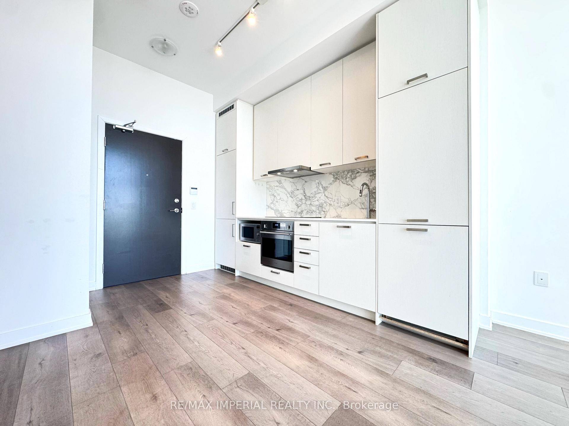 Modern 1 Bedroom Den condo with soaring 10 foot ceilings and floor to ceiling windows offering stunning southwest views in the heart of Vaughan.