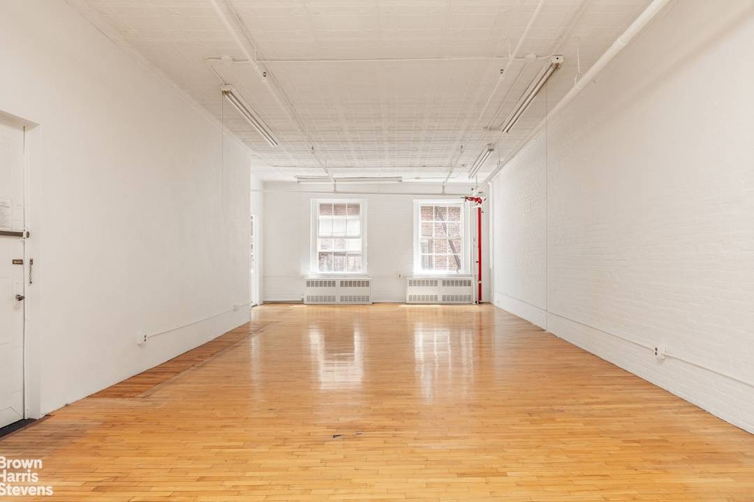 Authentic Full Floor SoHo Artist Loft with Private Storage and Roof Terrace Access Perched on the top floor of a classic SoHo cooperative, Residence 5N at 431 West Broadway is ...