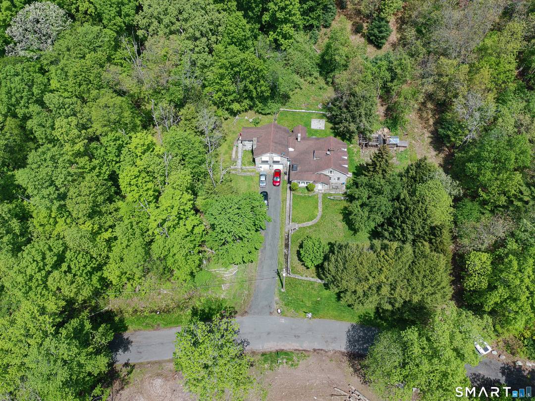 Welcome to this private 21 acre parcel in Glastonbury featuring a charming early 1900s home surrounded by peaceful natural beauty.
