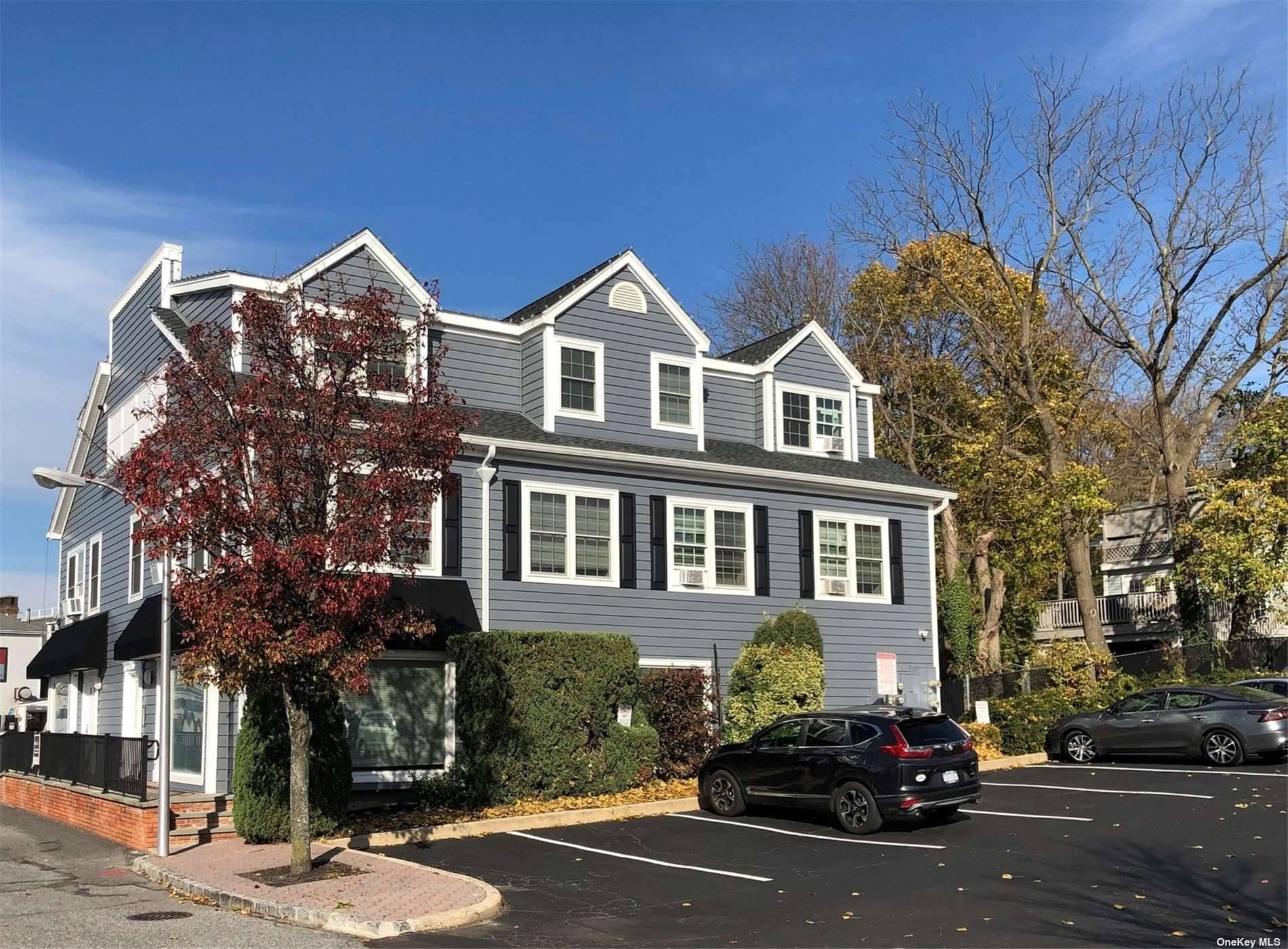 Beautiful three story professional building with updated office space for lease on the first floor.