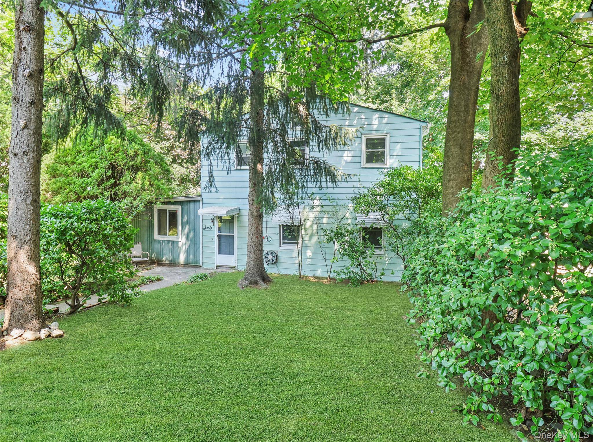 Spacious 4 bedroom single family home in Nanuet with a very private lot and 4 car parking.