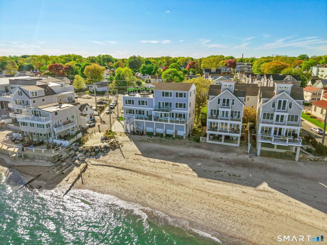 The Shore House at Walnut Beach in Milford offers an extraordinary beachfront retreat with sweeping panoramic views of Long Island Sound and direct beach access steps from your door.