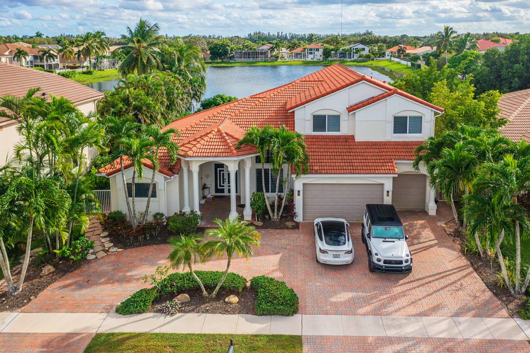 Experience luxury and comfort in this spacious waterfront pool home perfect for a large family with room for everyone.