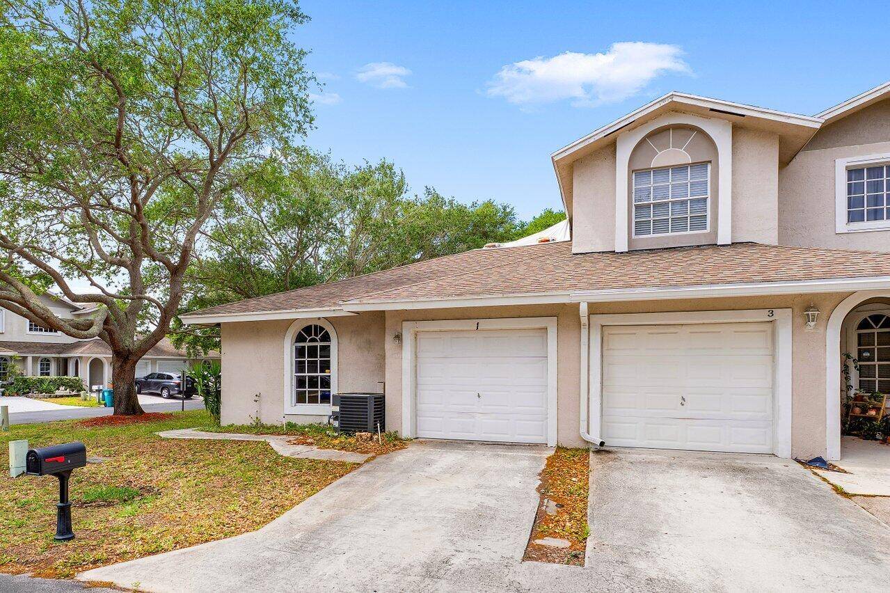 Beautifully updated 2BR 2BA corner villa with 1 car garage and split floor plan and BRAND NEW ROOF !