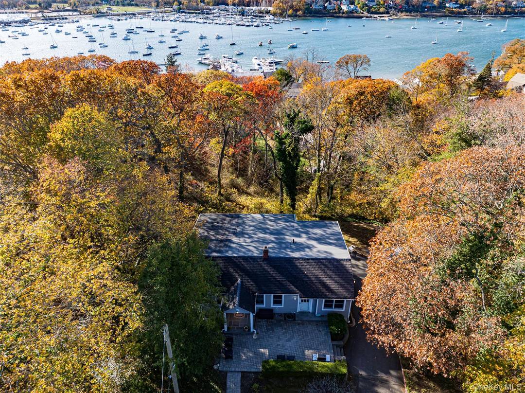 Picturesque setting with waterviews of Huntington Harbor in Halesite !