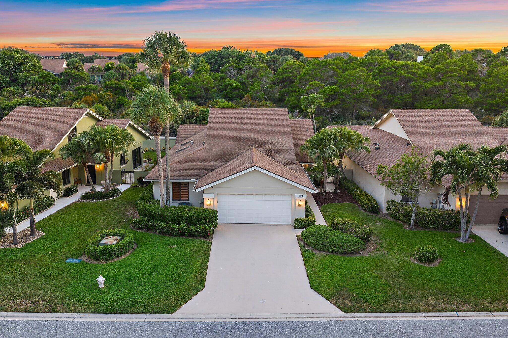 Just steps from the beach, 104 Sand Pine Drive sits on one of the most coveted lots in Jupiter's iconic Bluffs neighborhood.