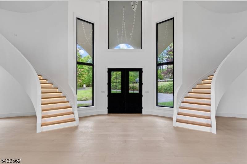 Introducing 809 W. Shore Road, a fully renovated, approximately 9, 000 square foot residence in Smoke Rise, offering refined lake living with modern construction and design.