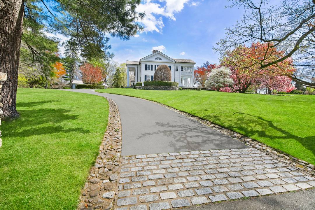 Step into timeless sophistication at this breathtaking Neoclassical estate, ideally located on over 4 pristine acres in one of New Canaan's most sought after locations.