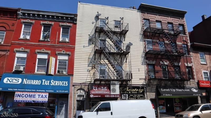 Bankruptcy Sale. Mixed use property with 2 retail units on the ground, 6 apartments above and 1 studio apartment in the rear with a private entrance and fenced garden patio ...