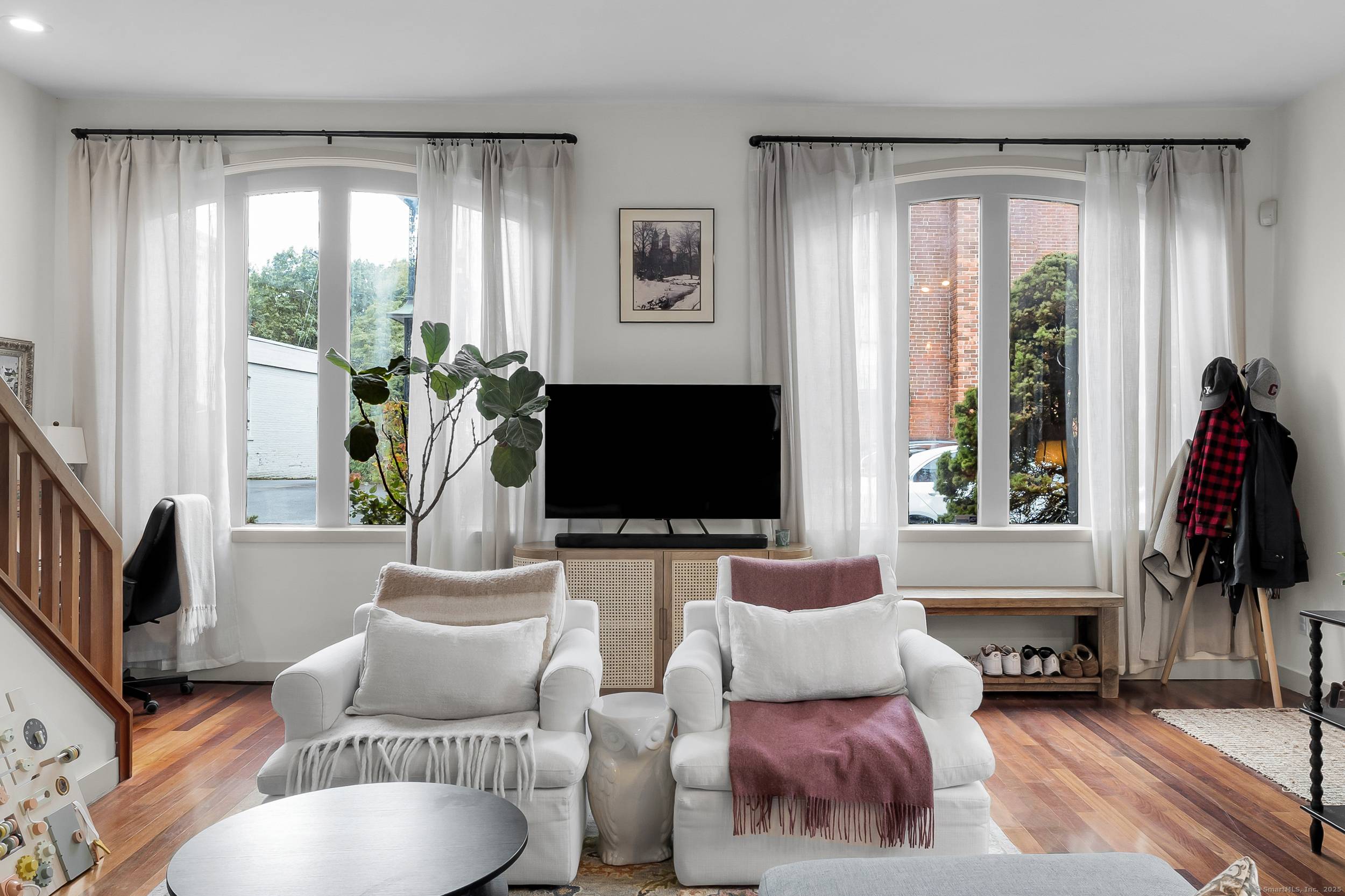 Housed in a beautifully converted former carriage house, this unique residence blends classic charm with modern design.