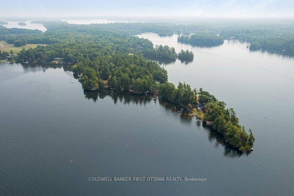 Heavenly two acre peninsula on Opinicon Lake that's intricate part of Rideau Canal system for great swimming, boating amp ; fishing.