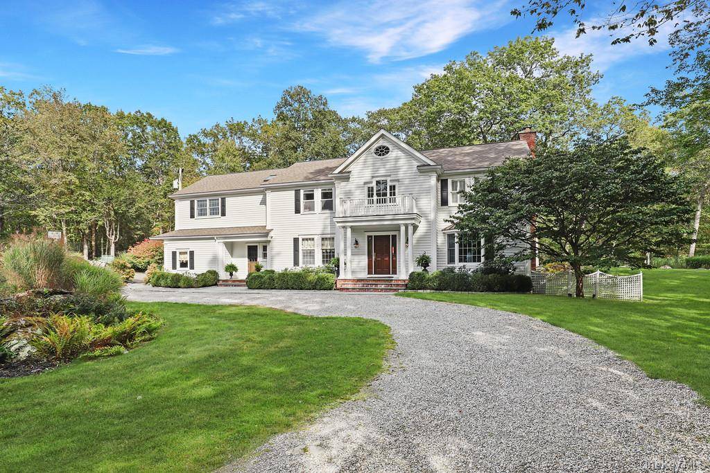 Perfectly sited at the end of a quiet cul de sac, this Pound Ridge residence combines timeless charm with modern comfort on two beautifully landscaped acres.