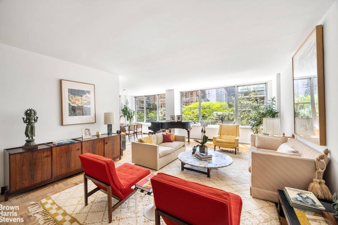 Spacious 2 bedroom 2 bathroom with oversized windows and the prettiest tree top views in the heart of the Upper East Side.