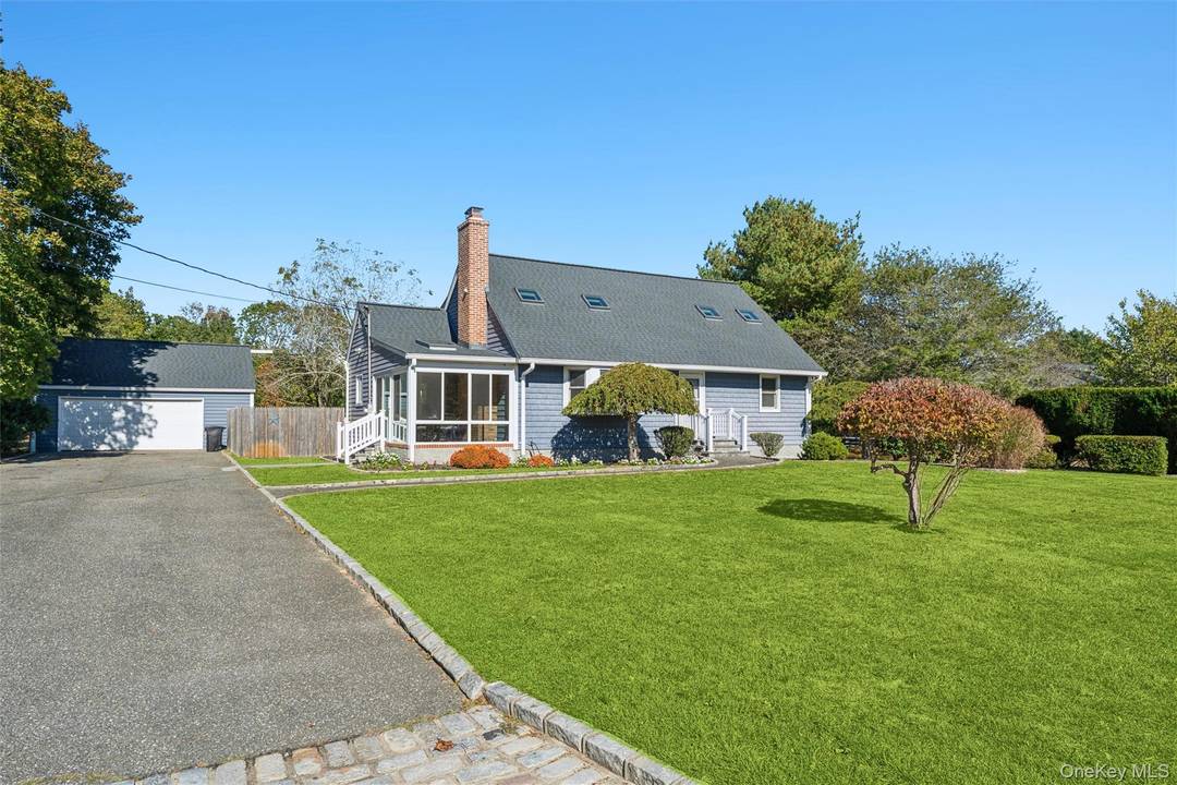 Welcome to this beautifully maintained 4 bedroom, 2 bath home located on a spacious property in the heart of Center Moriches.