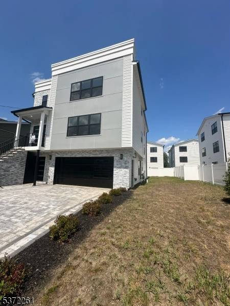 This newly built, architecturally designed duplex apartment offers refined living across two spacious floors, featuring three bedrooms and three full bathrooms.