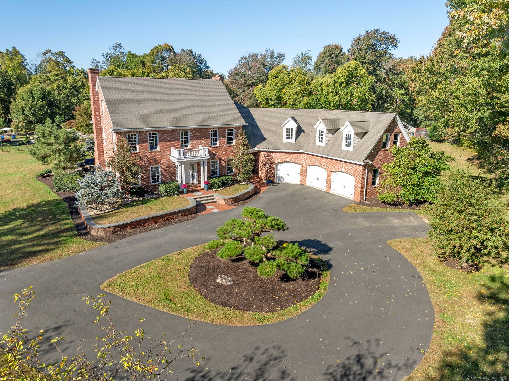 Magnificent Custom Brick Estate nestled on Old Main Street with 11.
