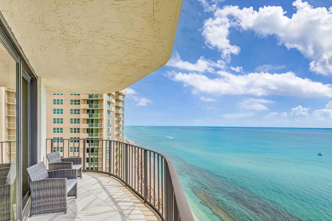 Seasonal price. Direct ocean, 14th floor, wrap around balcony with unbeatable views where you can see miles and miles of beach.