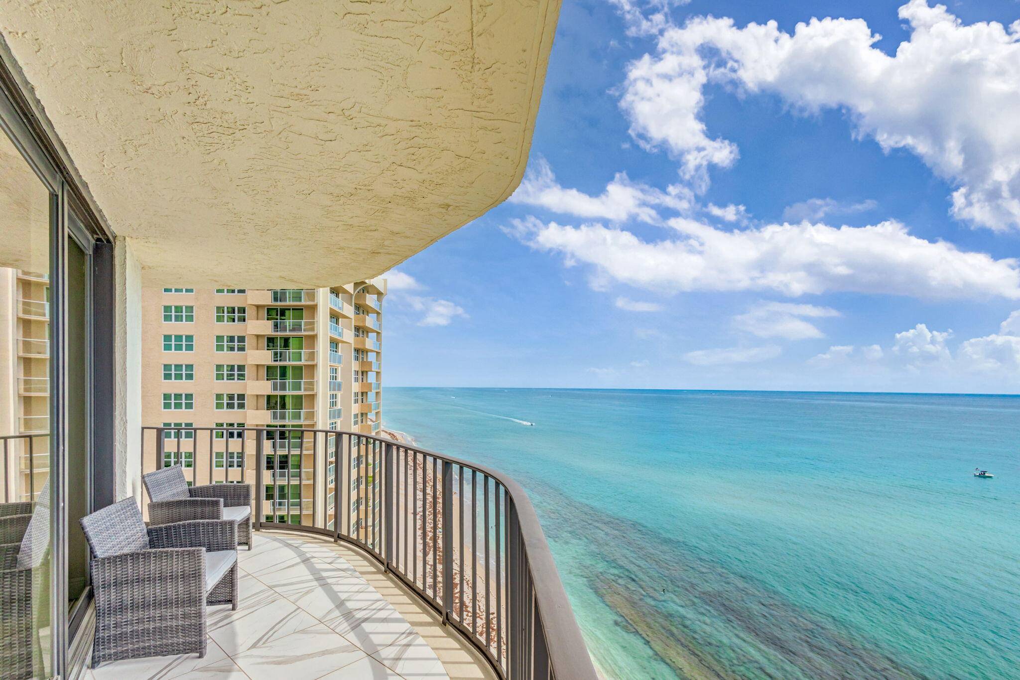 Seasonal price. Direct ocean, 14th floor, wrap around balcony with unbeatable views where you can see miles and miles of beach.