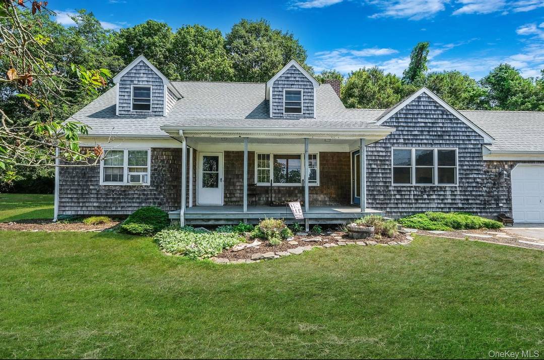 Wake up to the sound of gentle waves and breathtaking sunrises over Gardiner Bay in this charming four bedroom, two bath coastal retreat.