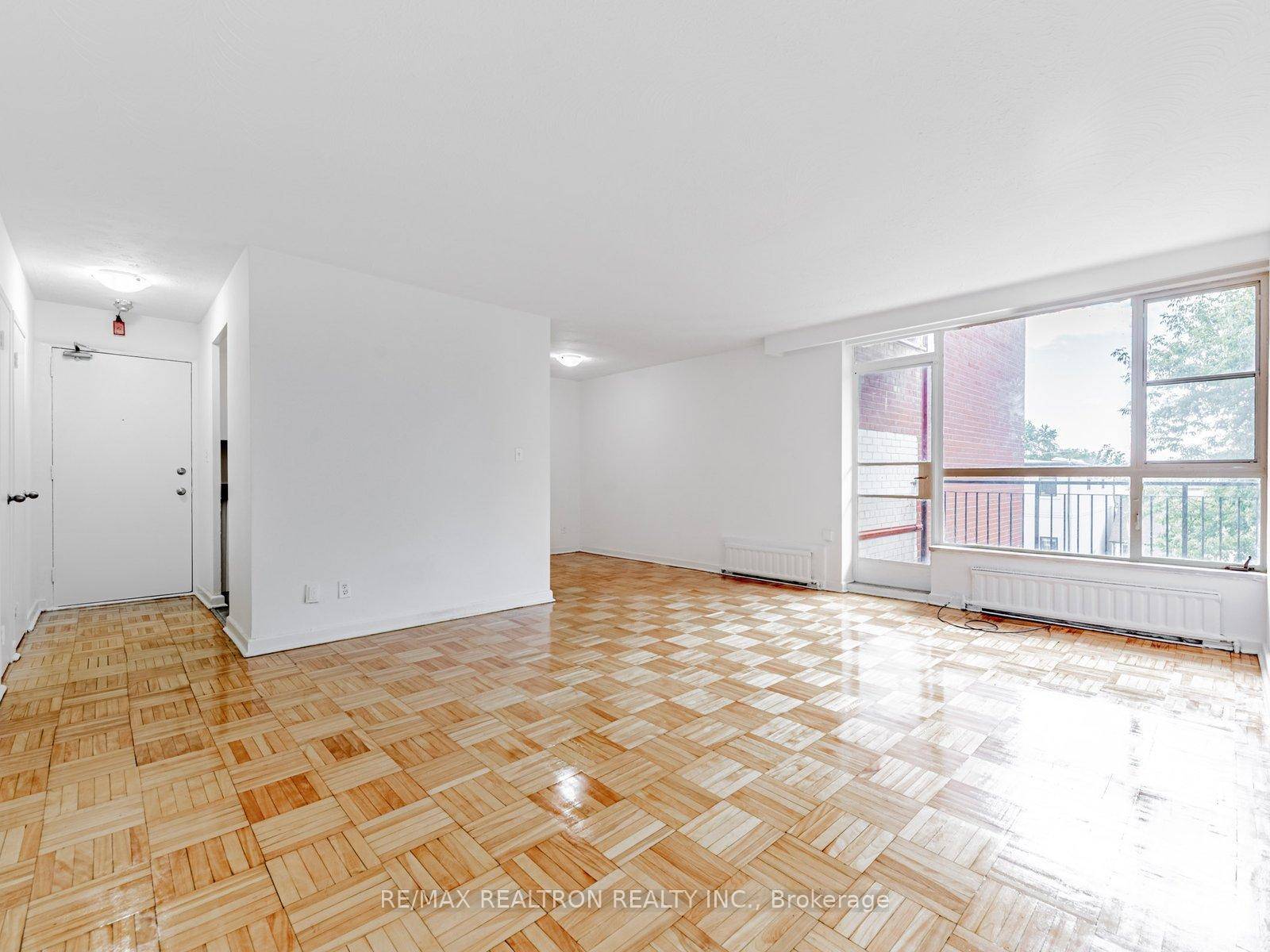 Fully renovated unit in East York featuring a new fridge, stove, and dishwasher, with a private balcony offering fresh air and neighborhood views.