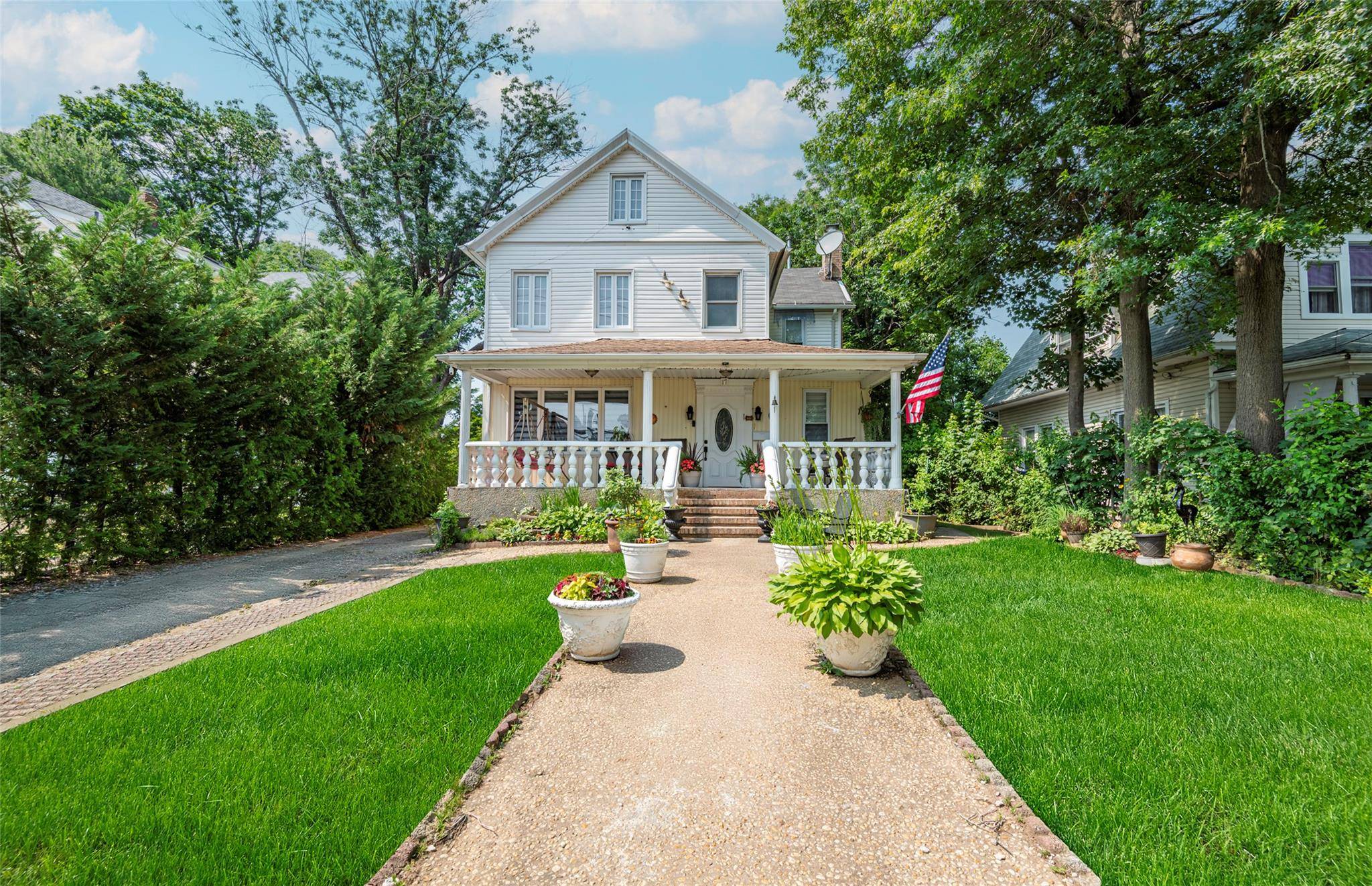 Great Neck North Charming Colonial On a Magnificent 50 x 200 Park like Grounds.