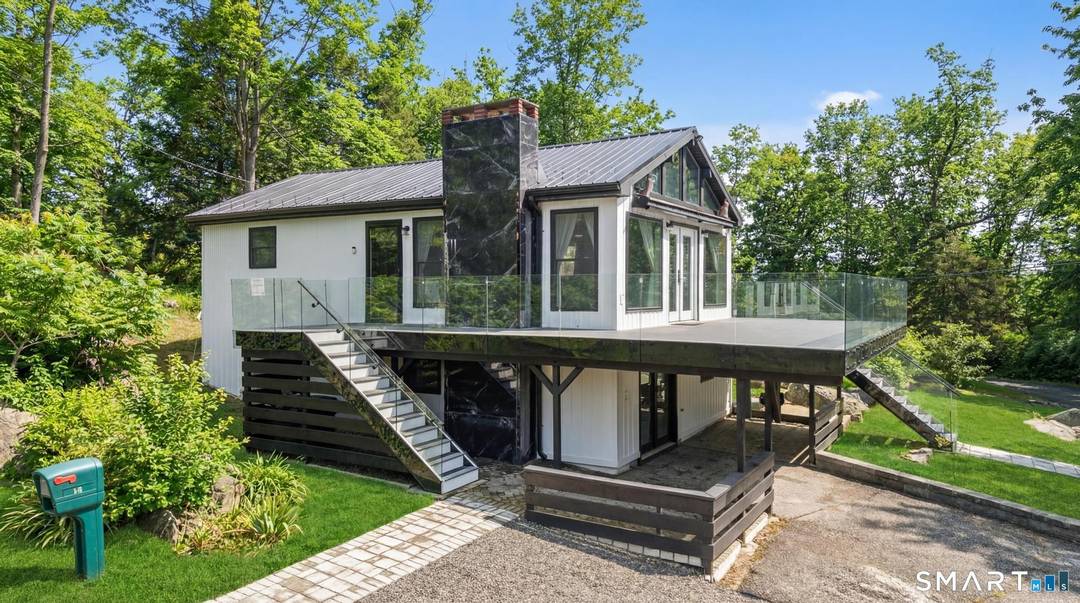 Modern, fully renovated retreat directly across from Candlewood Lake, steps away from Gerard's Marina.