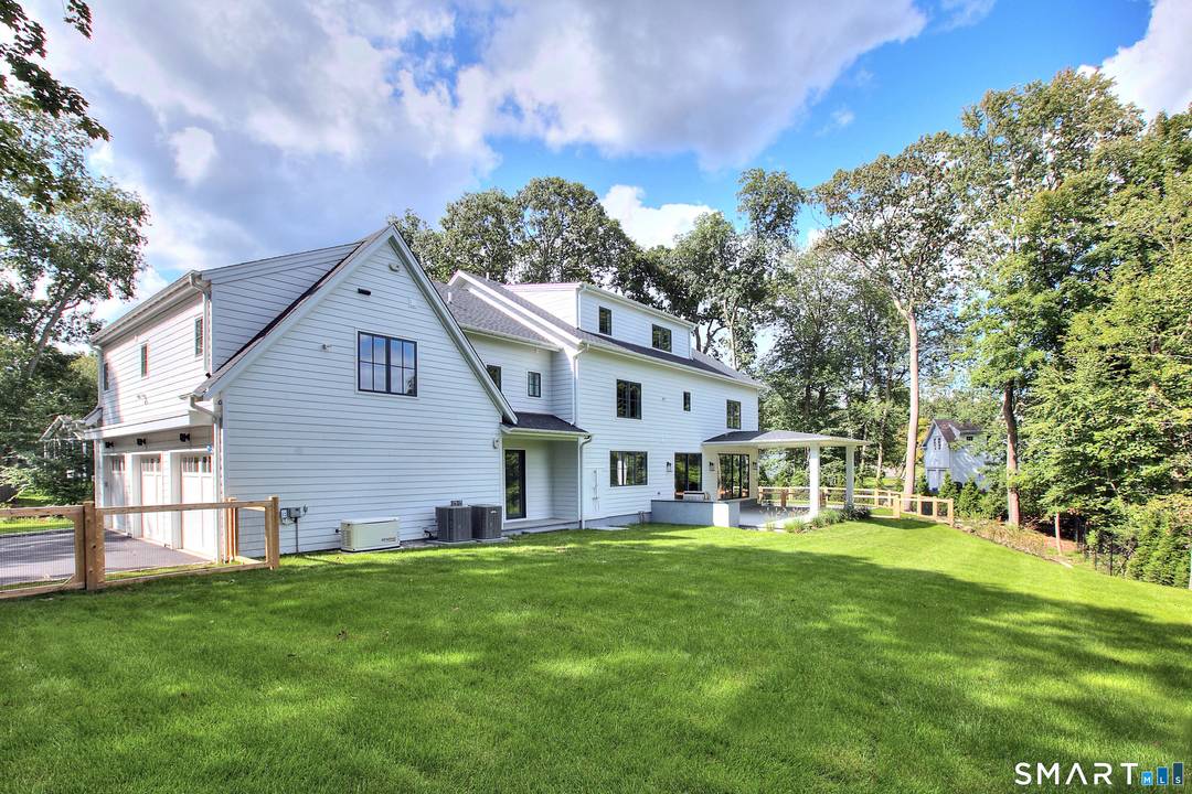 Stunning modern transitional home built by Compo Luxury Homes in 2024 and ideally located just minutes to downtown Westport, Compo Beach, and the train.